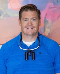 Portrait of a dentist at Benchmark Dental focused on patient comfort and care